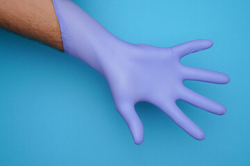 Doctor Gloves - Clinical Rubber Hand - Sterile Medical Equipment - Male Wearing Gloves putting on Rubber Surgery Gloves