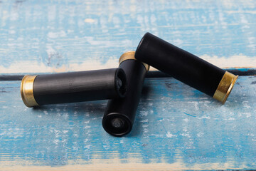 Hunting rifle cartridges. Cartridges on a white isolated background. Cartridges on a wooden table. 