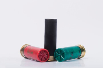 Hunting rifle cartridges. Cartridges on a white isolated background. Cartridges on a wooden table. 