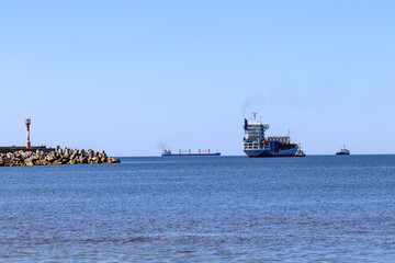 The container ship goes past the northern pier to the Baltic Sea. Baltiysk. Kaliningrad region