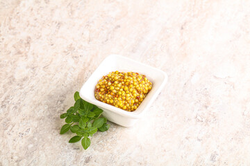 Grain mustard sauce in the bowl