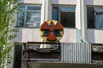 Sign of radiation hazard against radioactive waste on the building