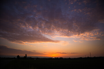 A beautiful evening scenery of a rural landscape. Sunset in the country landscape. Summertime scenery of Northern Europe.