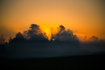 A beautiful evening scenery of a rural landscape. Sunset in the country landscape. Summertime scenery of Northern Europe.