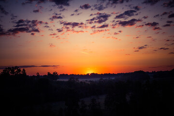 A beautiful evening scenery of a rural landscape. Sunset in the country landscape. Summertime scenery of Northern Europe.