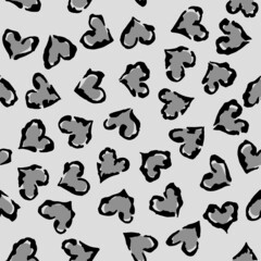 Leopard heart seamless pattern. Vector animal print. Black and grey spots on light grey background. Jaguar, leopard, cheetah, panther fur. Leopard skin imitation can be painted on clothes or fabric.