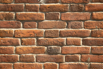 An old brick wall of the 19th century.The background of an old brick wall.