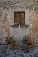 Obraz na płótnie Canvas old window with flowers