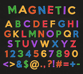 Alphabet, numbers and symbols. Colored magnets letters and numbers on a black school chalkboard background.