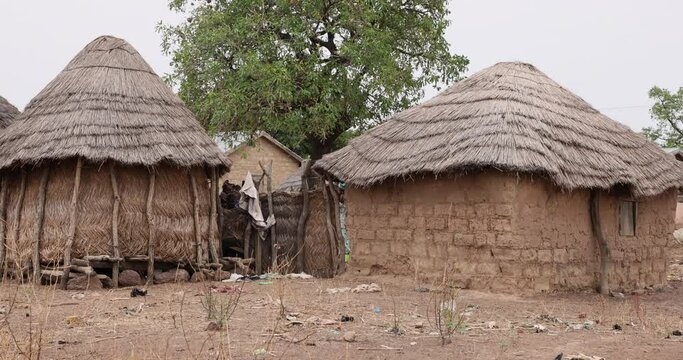 Grass and mud hut rural northern Ghana Africa. Northern Savannah region of Ghana. Rural traditional mud and straw huts and buildings. African tribal and native homes far from civilization.