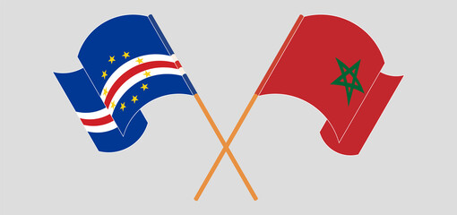 Crossed and waving flags of Cape Verde and Morocco