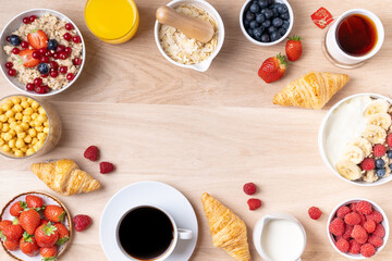Healthy breakfast set on wooden background. The concept of delicious and healthy food. Mix nuts, honey, berries, orange jus, pancake and milk. Top vi