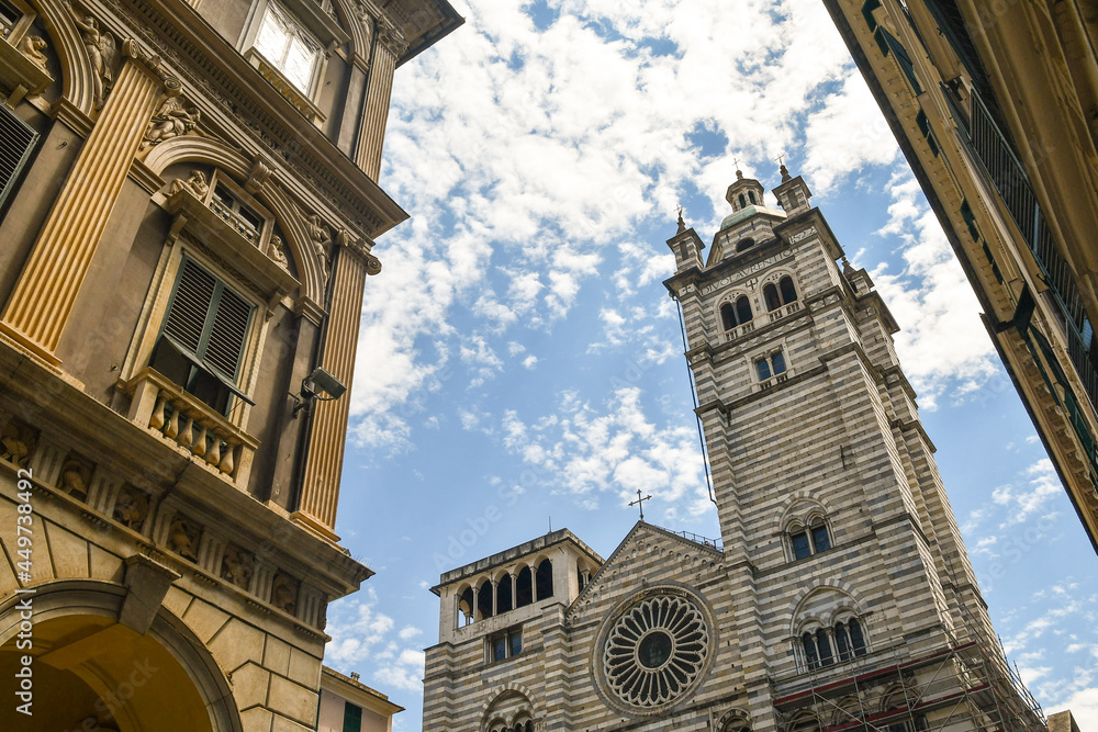 Wall mural low-angle view of the bell tower of the cathedral of saint lawrence in the historic centre of genoa 