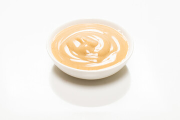 Mushroom sauce in a bowl isolated on white background.