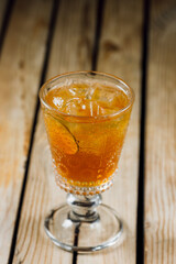 classic old fashion cocktail on a wooden background with lines. bar menu concept.
