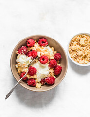 Homemade frozen yogurt ice cream with raspberries and sugar crumb cookies on a white background, top view