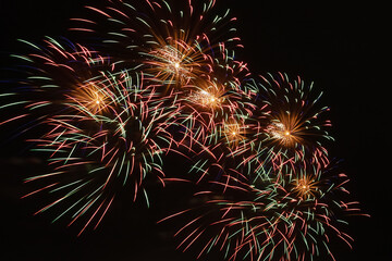 colorful bright fireworks lights in the night sky, for Christmas or new year design