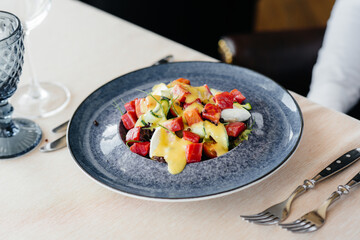 Natural and delicious tuna salad with tomatoes poured with cream sauce close-up. Healthy food is good for your health.