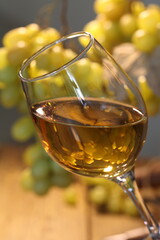 Still life with white wine and grapes