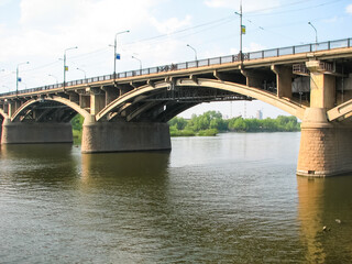 Fototapeta na wymiar Bridge over the Yenisei River in city of Krasnoyarsk. Communal bridge