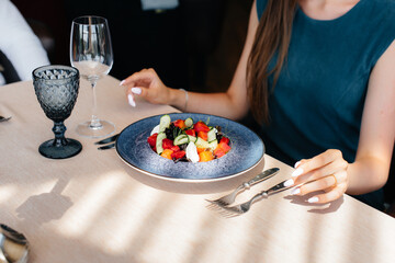 Exquisite salad close-up in a modern restaurant close-up. Customer service in the catering.