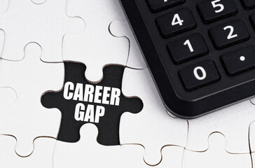 There is a calculator on white puzzles, an inscription in an open cell - Career Gap