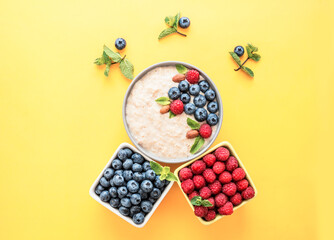 Homemade aromatic oatmeal with berries for breakfast