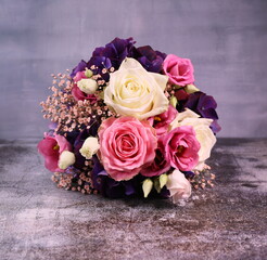 bouquet of pink  and white roses on the grey background