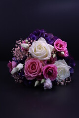 wedding bouquet of roses and hortensia on the black background
