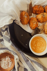 Southern fish fritters with remoulade sauce in cast iron pan