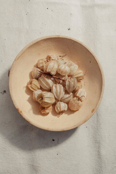Gooseberries in a bowl on a canvas background