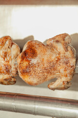 Whole chickens on a rotisserie 