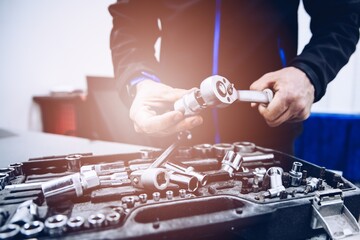 Man worker of service assembling wrench and tools