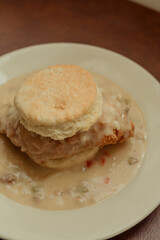 Southern-style smothered fried chicken biscuit