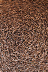 Background made of natural wicker texture. Details of a cozy interior in autumn style. Vertical