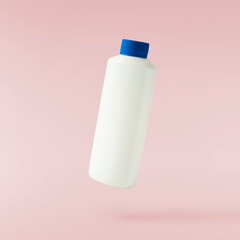 Household cleaning product. A plastic bottle falling in the air