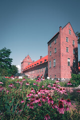 Flower garden in front of Scanian castle Bäckaskog in Sweden during summer