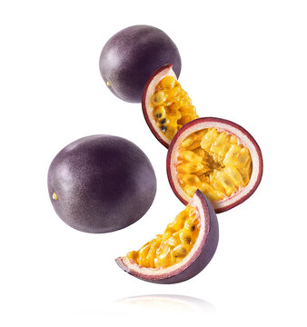 Fresh Ripe Passion Fruit Falling In The Air