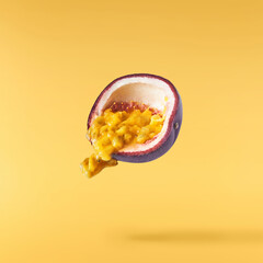 Fresh ripe passion fruit falling in the air