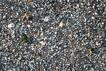 Clear texture of small pebbles on the road. 4k photorealistic texture