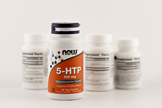 5-htp supplement capsules in the jar. dietary supplement editorial photo