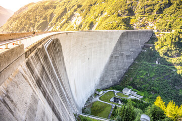 Huge concrete apline dam on sunny summer day. Zillergrundl Speicher, Zillertal Alps, Austria
