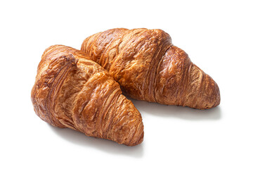 French croissants made of puff pastry, with a golden crust, on white