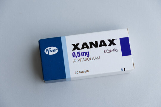 Tallinn, Estonia - July 16, 2021: Xanax tablets by Pfizer for treating panic and anxiety disorder. Pharmacy and medicine concept.