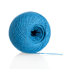 A skein of blue thread for sewing and repairing clothes, a spool with cotton, synthetic threads, isolated on a white background, close-up