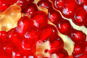 Pomegranate seeds, macro. Fruit of a juicy pomegranate in a cut. Fruit background
