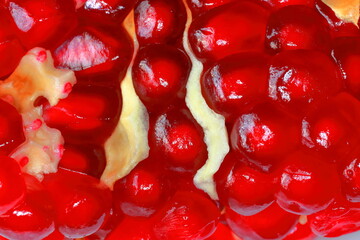 Pomegranate seeds, macro. Fruit of a juicy pomegranate in a cut. Fruit background
