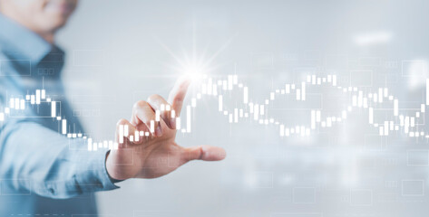 Businessman holding bar graph of analytics and financial, Changes in new planning, Business growth, ideas and perspectives, Stock investment, and dividends yield from business and stock market.