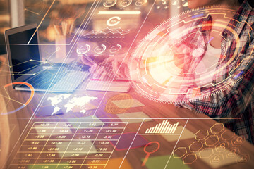 Multi exposure of woman hands working on computer and data theme hologram drawing. Tech concept.
