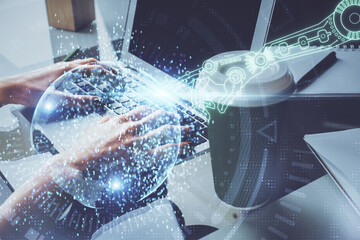 Double exposure of woman hands working on computer and data theme hologram drawing. Tech concept.